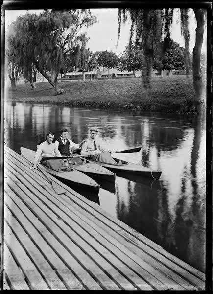Three men in canoes on the Avon River, 1900