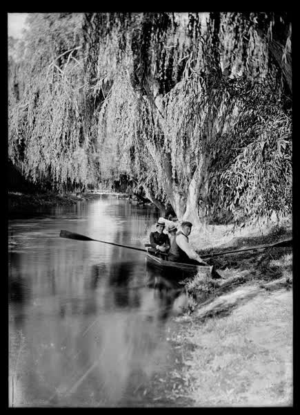 Man and two women in a rowboat, 1900