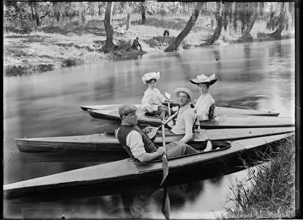 Two men and two women in canoes on the Avon River, 1900