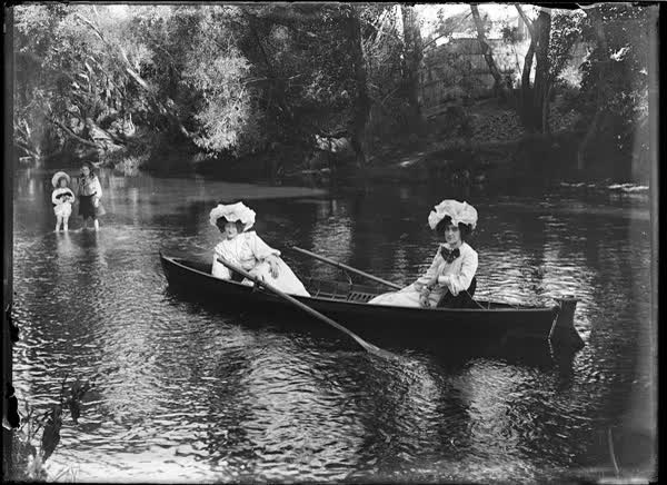 Two women in a rowboat on the Avon River, 1900