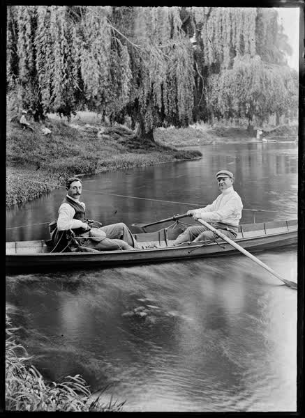 Two men in a rowboat on the Avon River, 1900