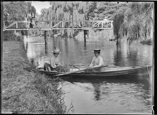 Two women in a rowboat on the Avon River, 1900