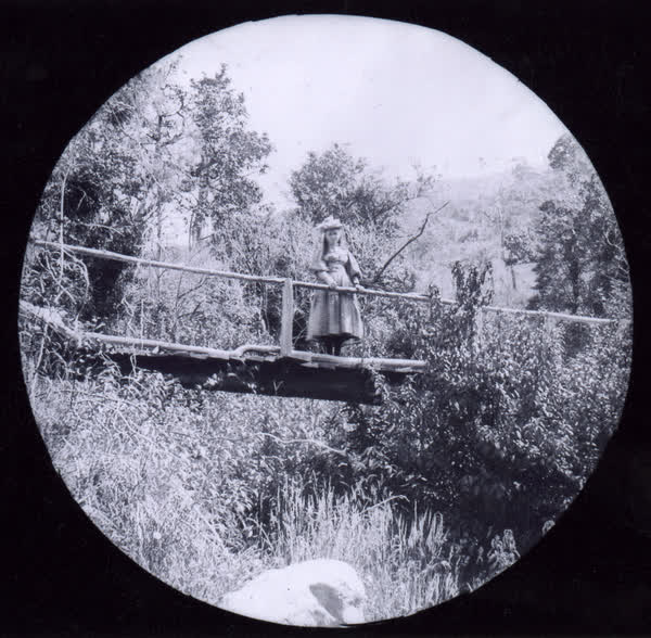 Girl on a plank bridge, 1900