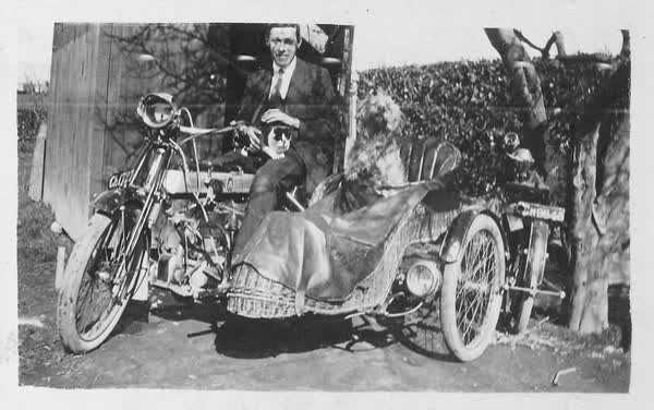Man, Cat and dog on motorcycle, 1925