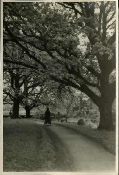 Woman walking beside Avon River, 1940