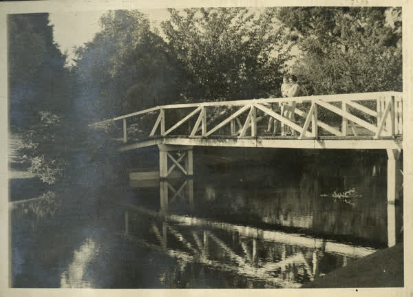 Woman and child on bridge, 1940