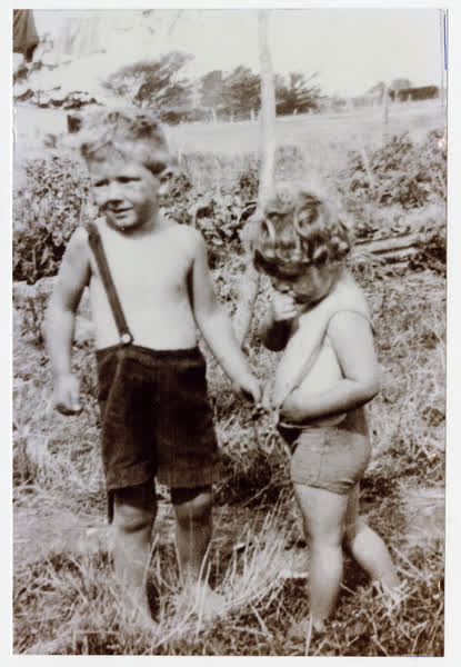 Two children in grass, 1943