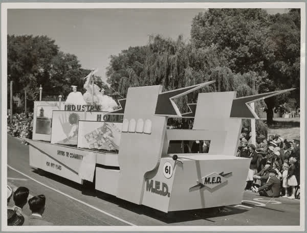 MED float in procession, 1950