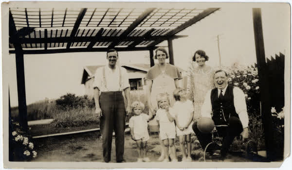 Macefield family standing under a pergola in Auckland, 1928