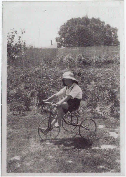 Ron Macefield on a tricycle, 1933