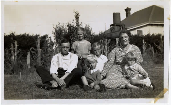Macefield family sitting on grass at Marlborough Street, 1935