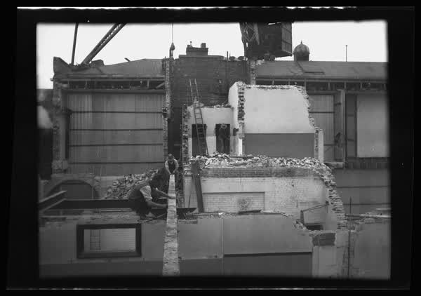 Workers demolishing MED building, 1938