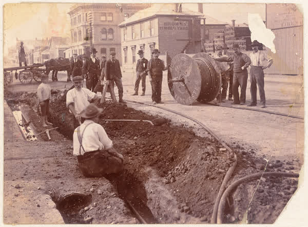 Workers laying a cable on Tuam Street, 1900