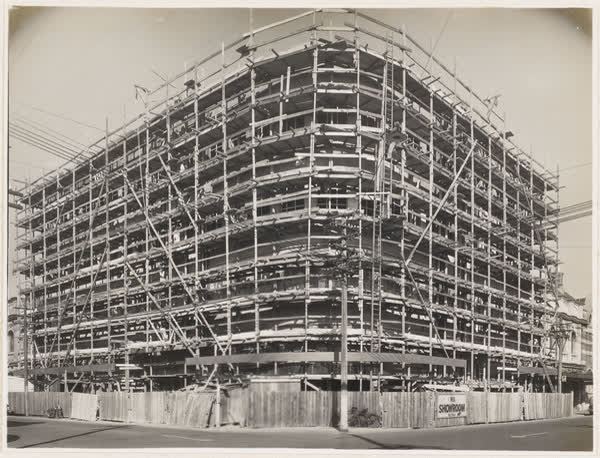 MED building surrounded by scaffolding, 1938