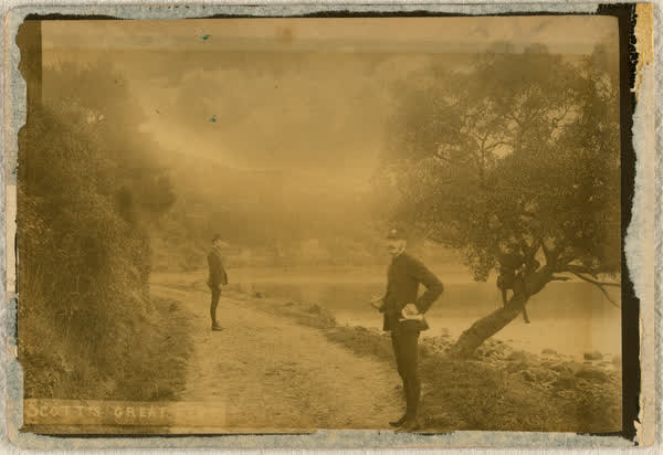 Alexander Lowry and Charles August Myhre standing on road, 1886