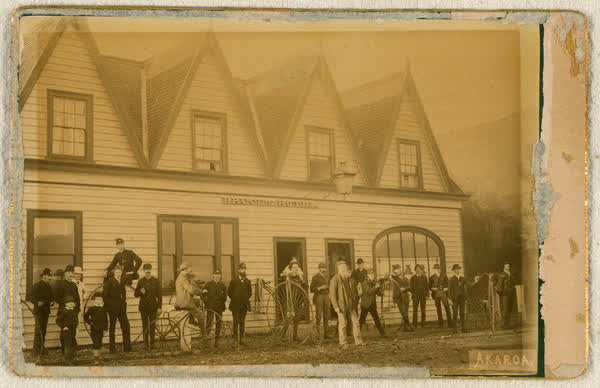 Unidentified men and boys outside Bruce’s Hotel in Akaroa, 1886
