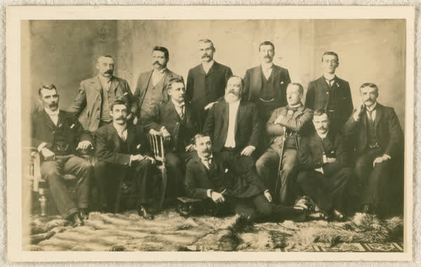 Thirteen men in suits, 1890
