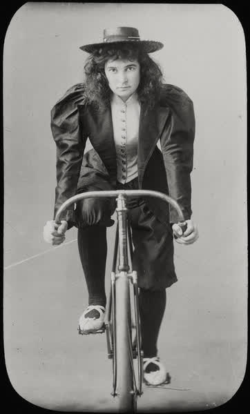 Unidentified woman on a bicycle, 1890