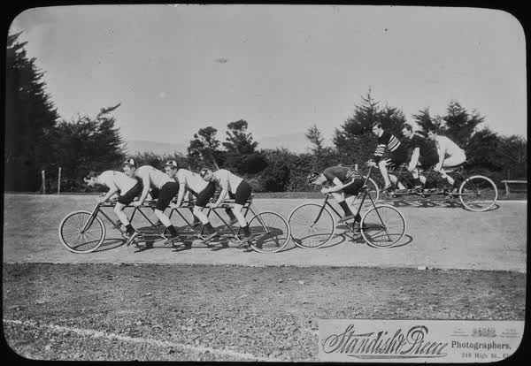 “Scorcher” Jones and seven unidentified men on cycles, 1897