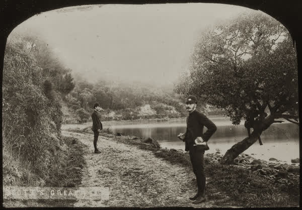 Alexander Lowry and Charles August Myhre standing on road, 1886