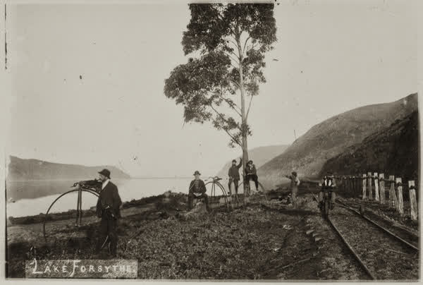 Six men by railway tracks beside Lake Forsythe, 1886
