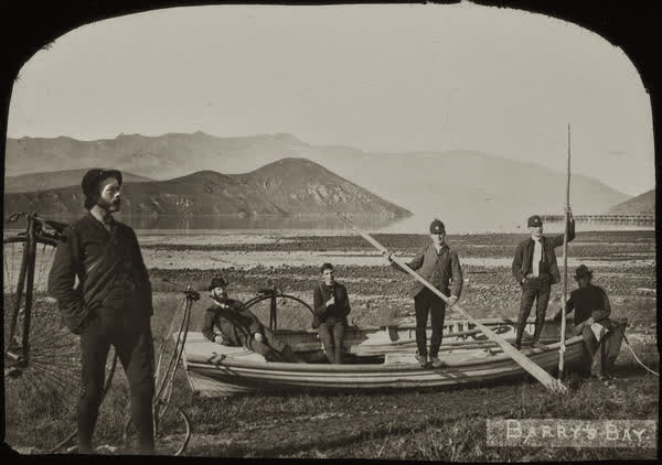 Six men with a bike and a boat in Barrys Bay, 1886