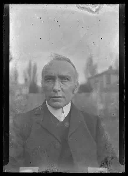 Man in backyard, 1900