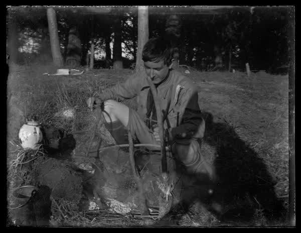 Scout building a fire, 1900