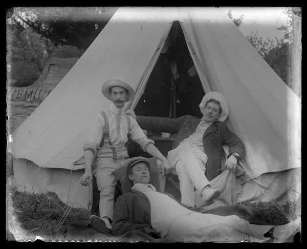 Relaxing by the tent, 1900