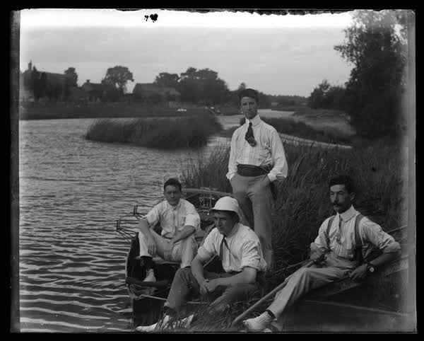 Relaxing after boating, 1900