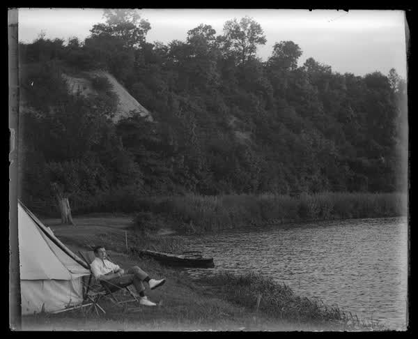 Camping by the river, 1900