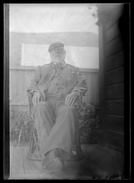 An elderly man sitting, 1900