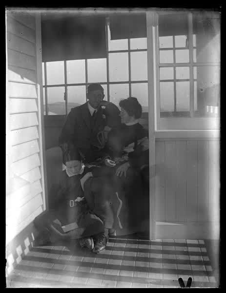 Older woman with a young man and young woman, 1900