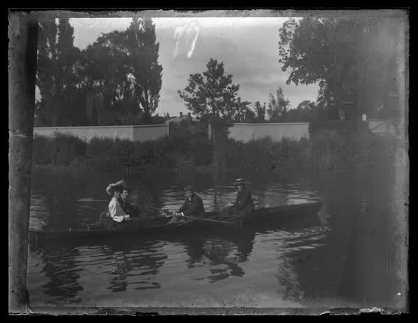 Four people in a row boat, 1900