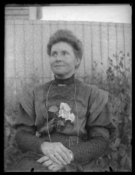 Woman in a garden, 1900