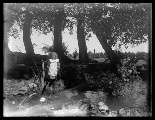 Girl by a stream, 1900