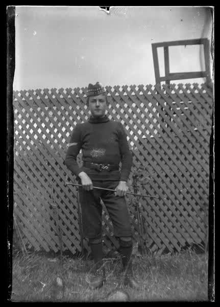 Young boy wearing a forage cap, 1900
