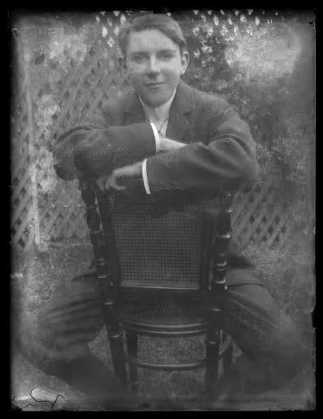 Young man sitting, 1900