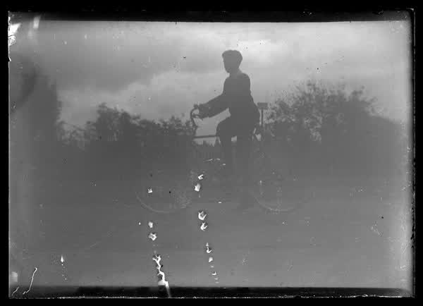 Boy on a bike, 1900