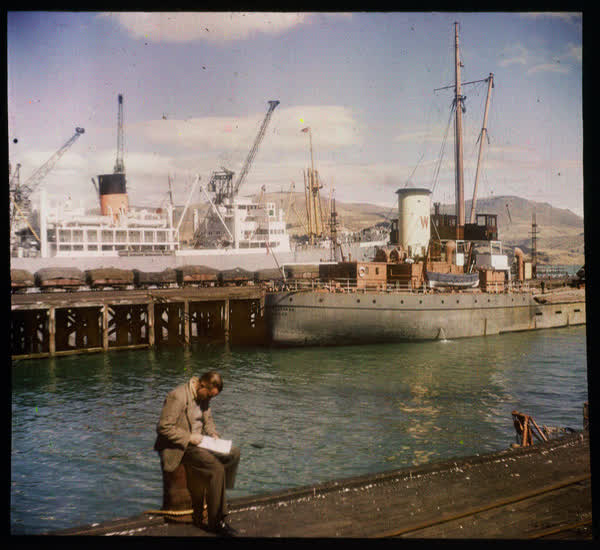 Man sitting in Lyttelton Port, 1950