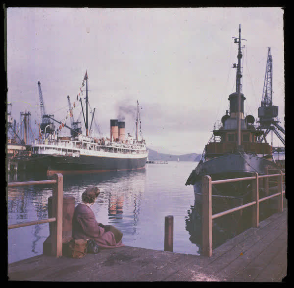 Woman sitting on a wharf, 1950