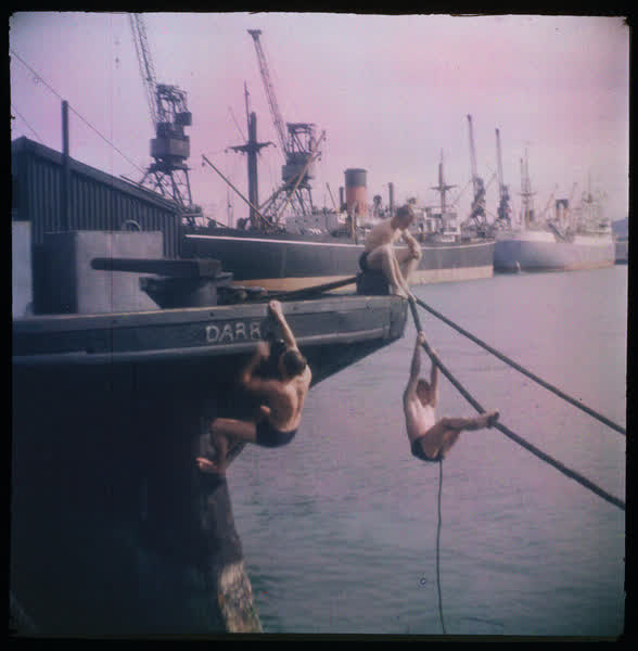 Three men playing on a barque, 1950
