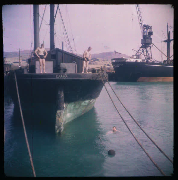 Men jumping off a boat, 1950