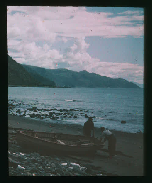 Two people dragging a dinghy, 1950