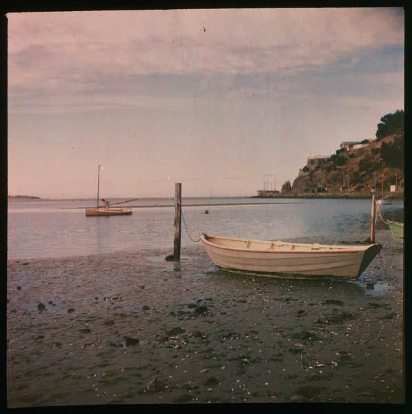 Dinghy tied to a pole, 1950