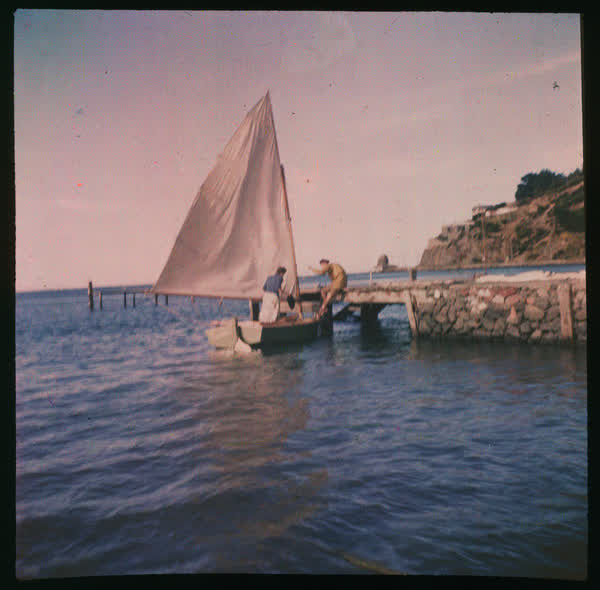 Disembarking a sail boat, 1950