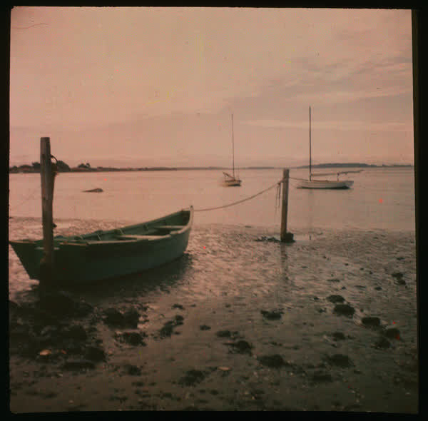 Dinghy beached and tied to a pole, 1950