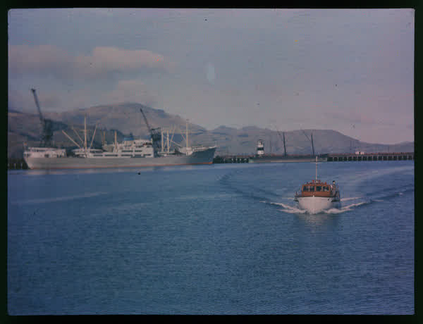Two men on a motor boat, 1950