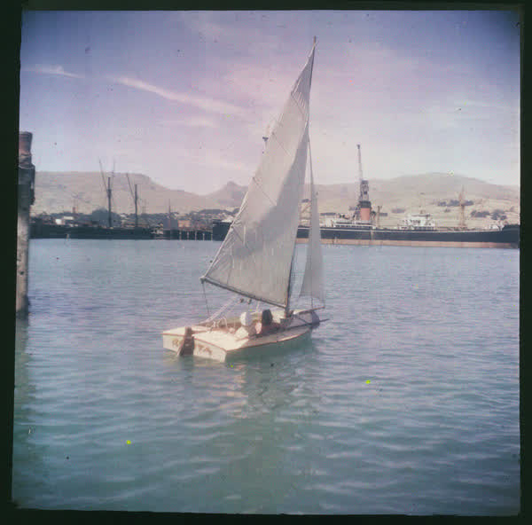 Two people on a sail boat, 1950
