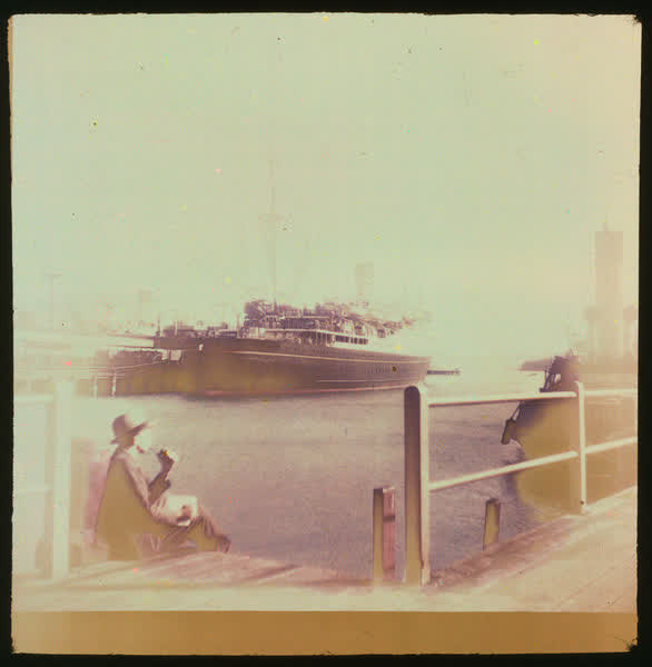 A man smoking on the Lyttelton wharf, 1950